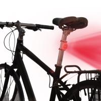 Designed with a curved back to fit snugly against rounded bike surfaces, this LED and Gear Tie Reusable Rubber Twist Tie combination can be used to light a bike for fun or safety.